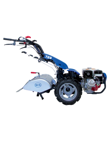Motocoltivatore BCS PowerSafe 728 con ruote robuste e fresatrice, adatto per lavorazioni agricole su diversi tipi di terreno.